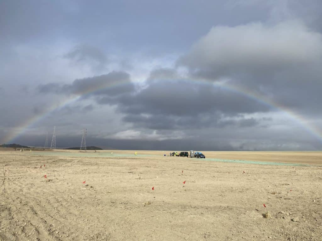 Rainbow over wetland restoration site