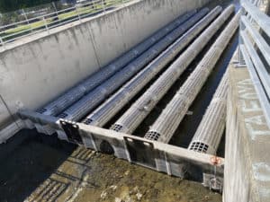 Canal with 6 mesh pipes filtering water