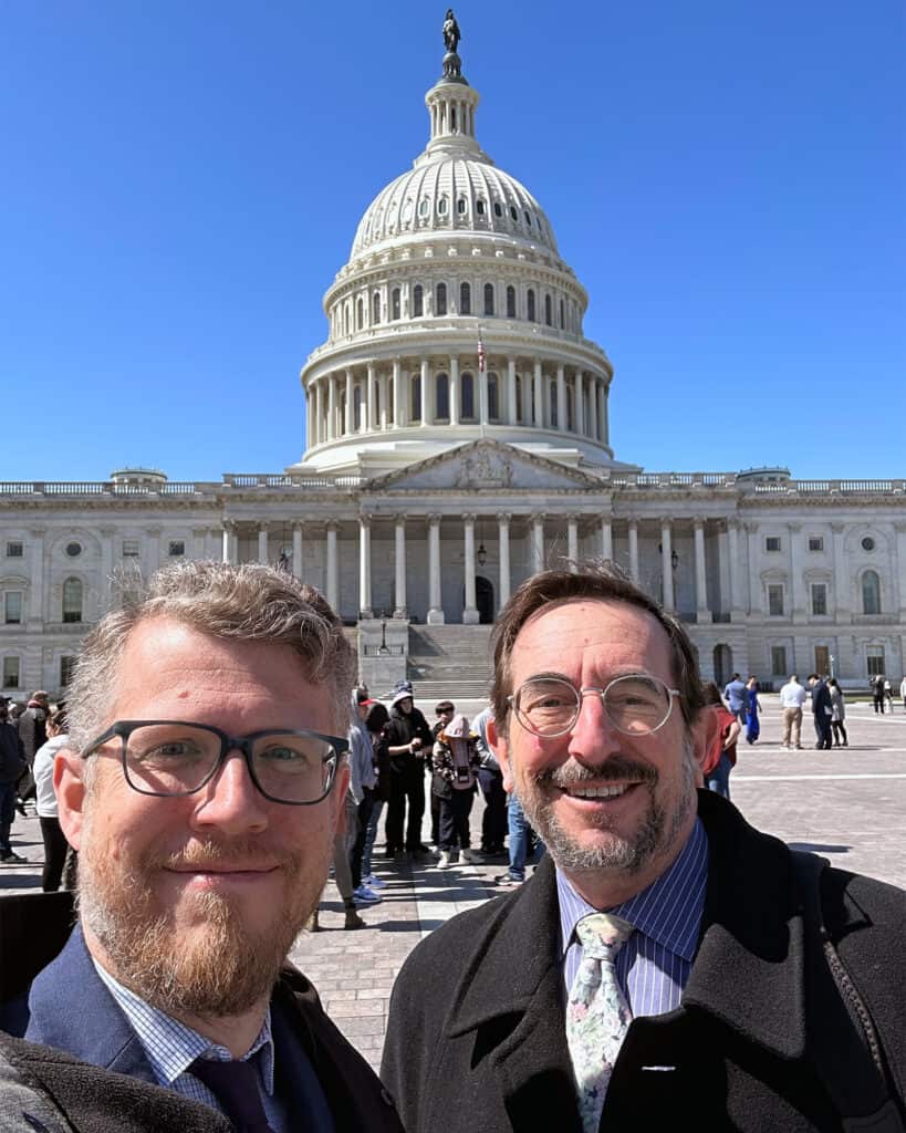 Selfie of two men outside the US Capitol building