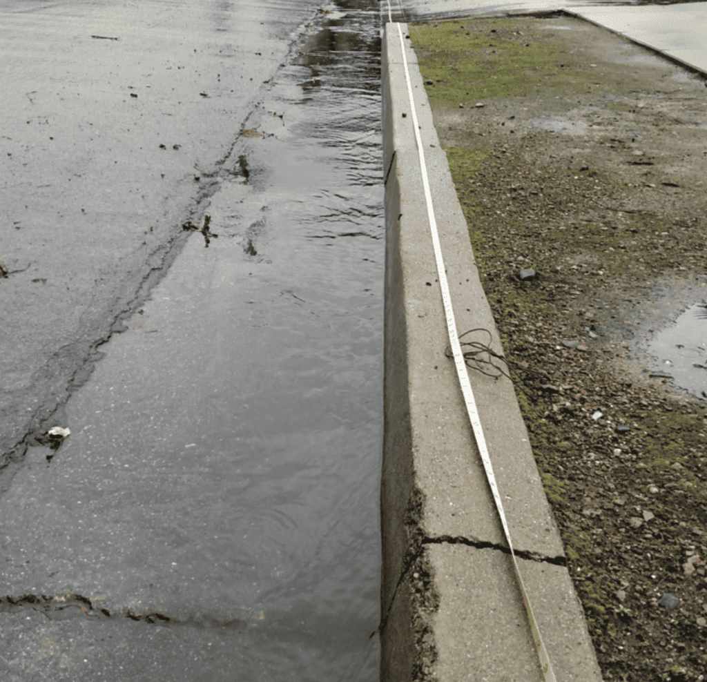 Curb with rain water pooling