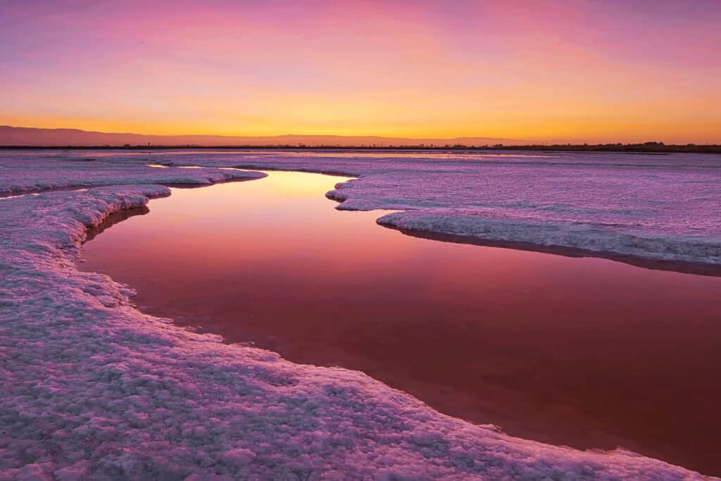 pink and orange salt ponds at Alviso reflecting the sunset